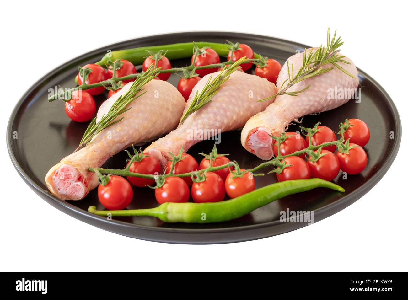 Pilon de poulet cru isolé sur fond blanc Banque D'Images