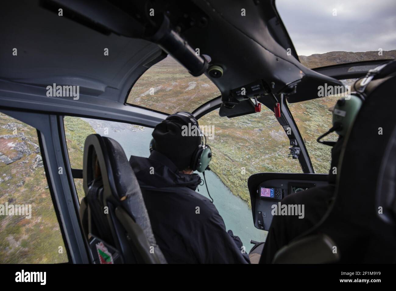 Pilote d'hélicoptère en cabine Banque D'Images