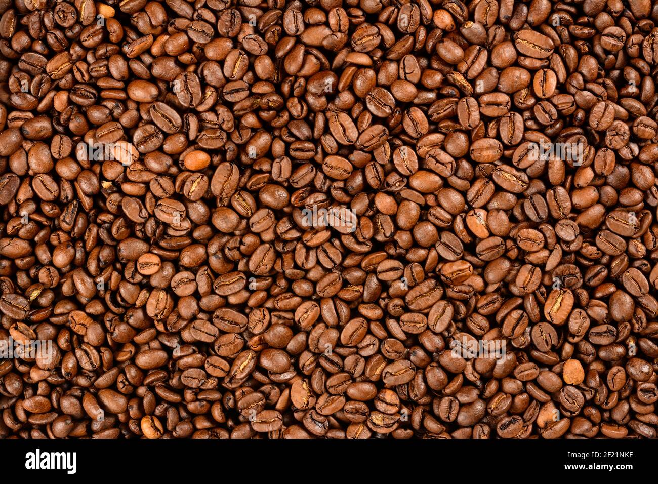 Fond de grains de café. Grains de café torréfiés Banque D'Images