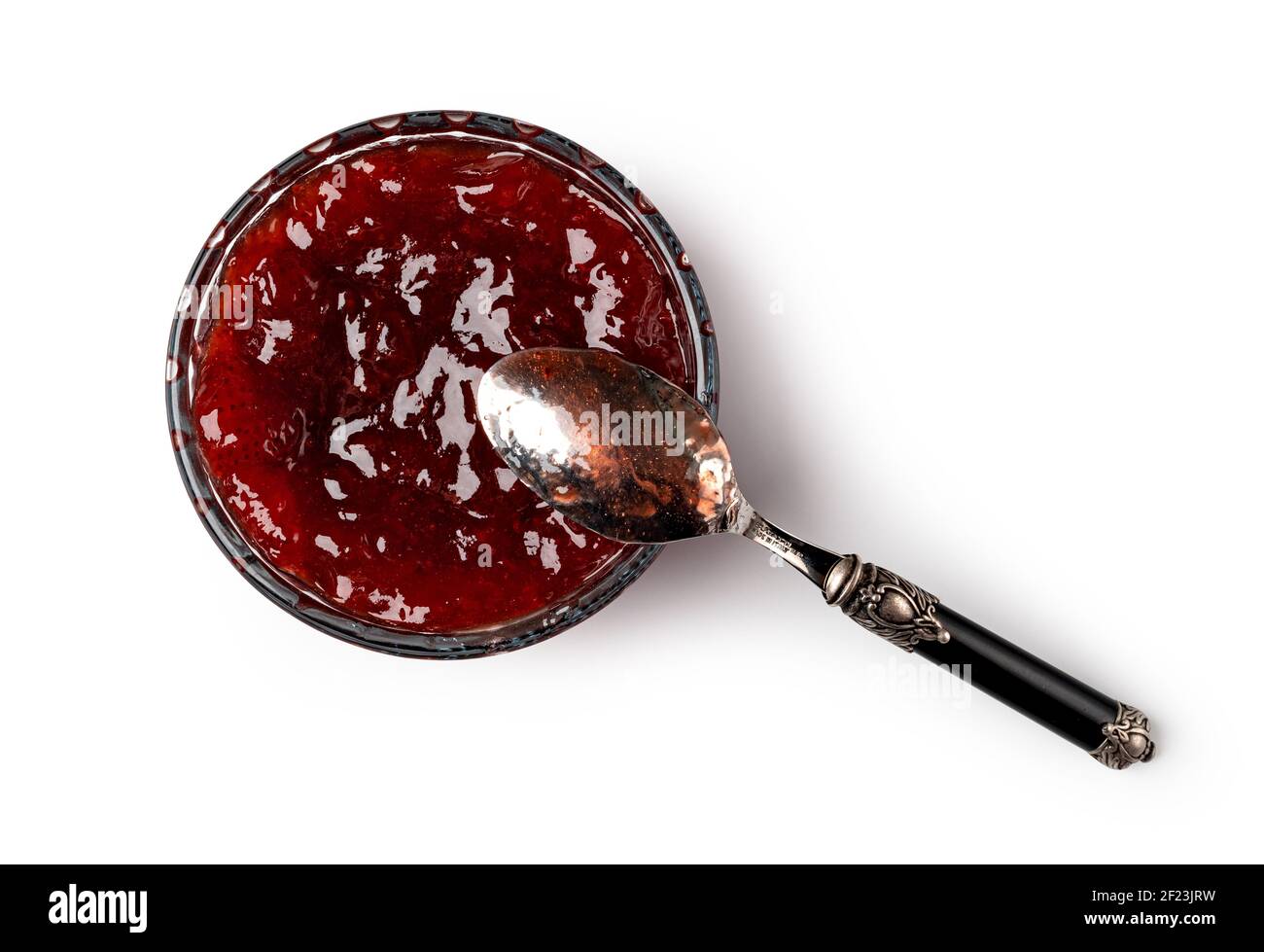 Bol en verre et cuillère de confiture de baies rouges Banque D'Images