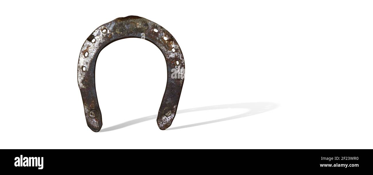 Fer à cheval avec trèfle chanceux sur fond blanc Banque D'Images