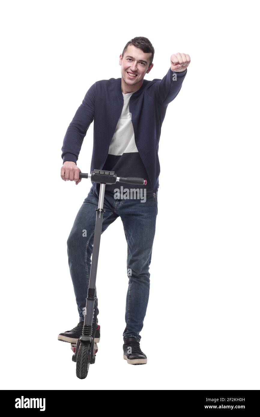 jeune homme souriant avec un scooter électrique . Banque D'Images