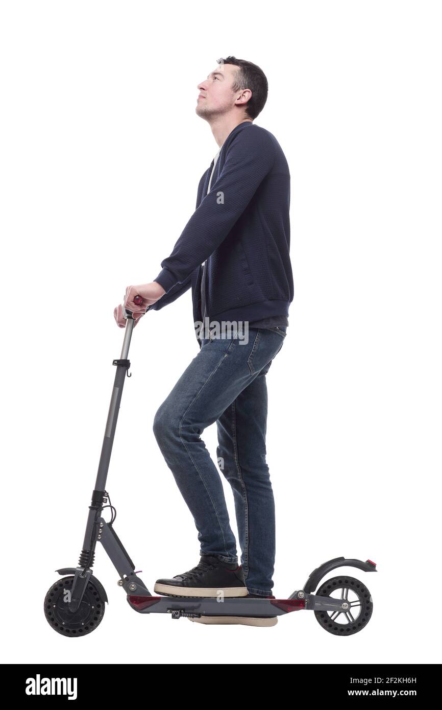 jeune homme souriant avec un scooter électrique . Banque D'Images