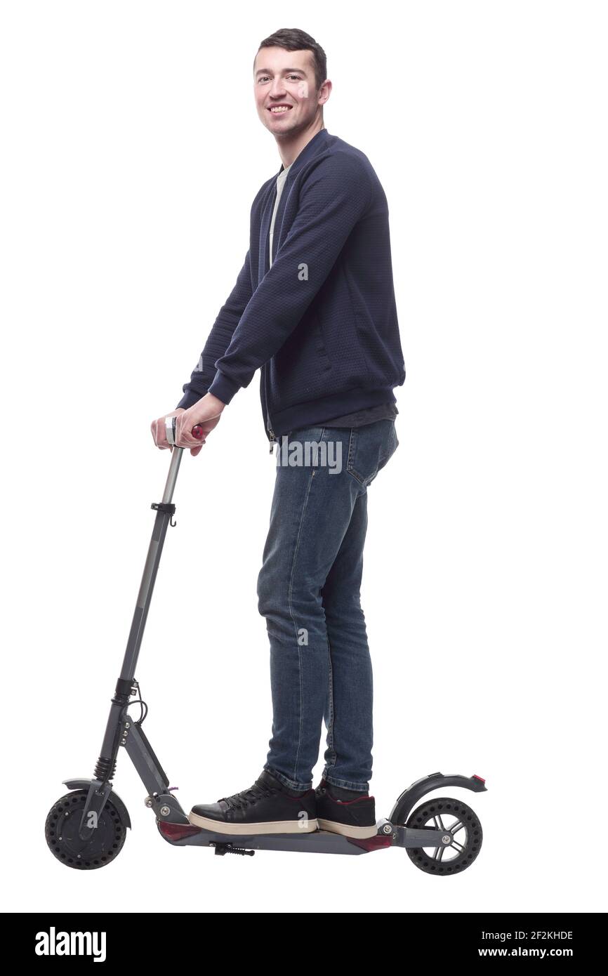 jeune homme souriant avec un scooter électrique . Banque D'Images