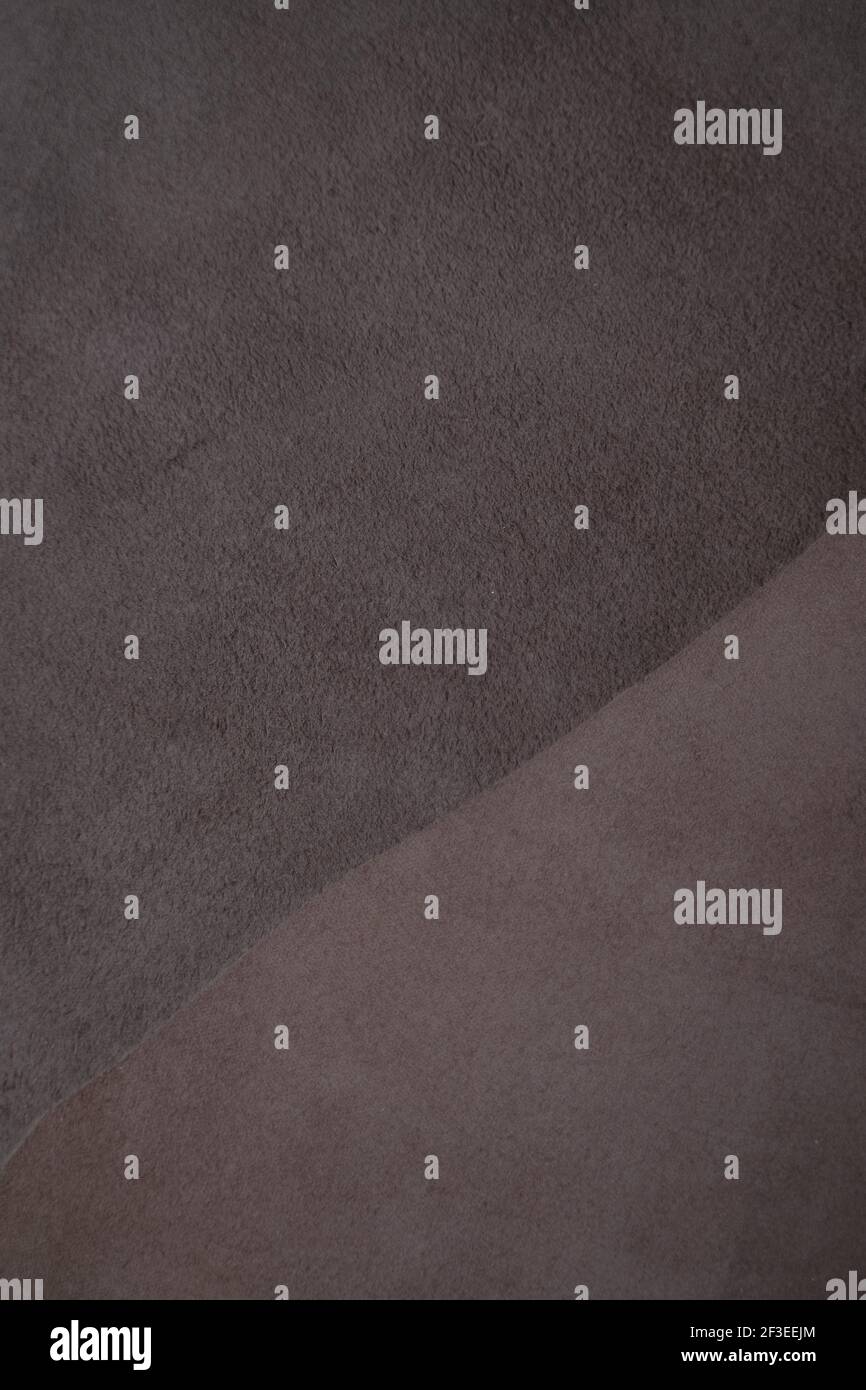 Arrière-plan en cuir. Texture du cuir véritable et du daim.morceaux de cuir brun.ensemble de morceaux de cuir véritable de couleurs brunes.Fabrication à partir de véritables Banque D'Images