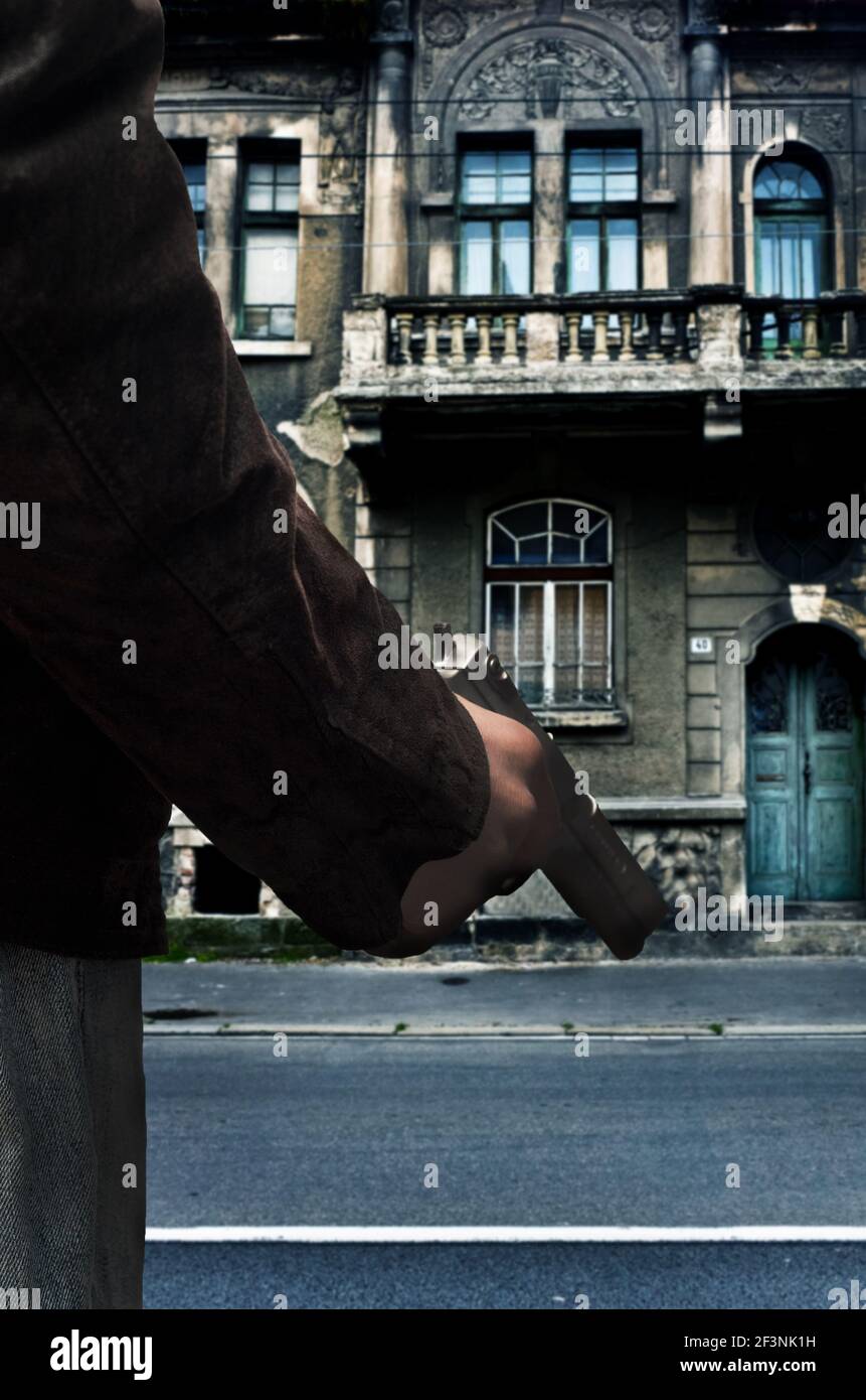 homme avec une arme à feu en main, image de crime mystère pour la couverture de livre Banque D'Images