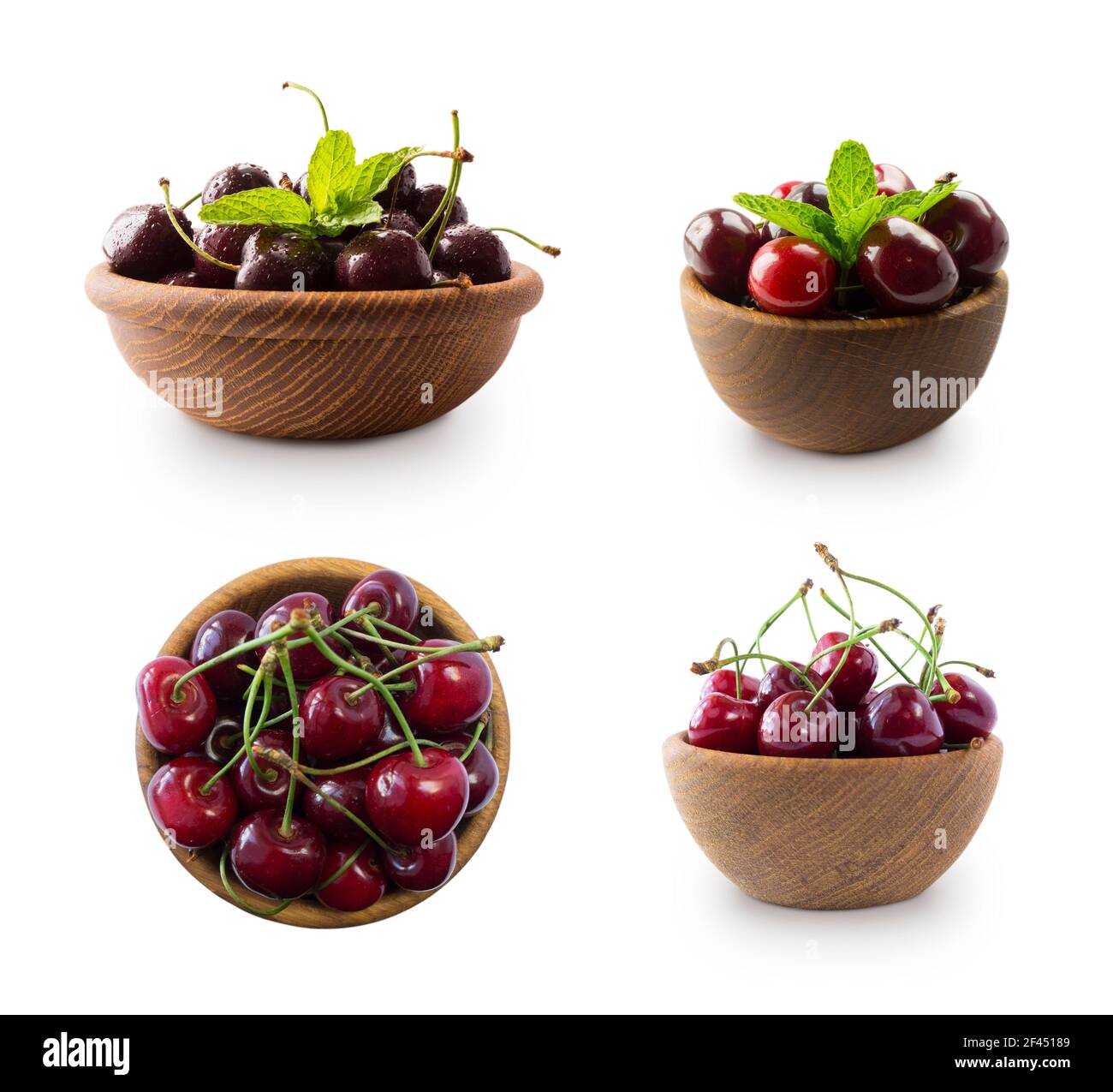 Cerises rouges dans un bol isolé sur fond blanc. Gros plan sur les ...