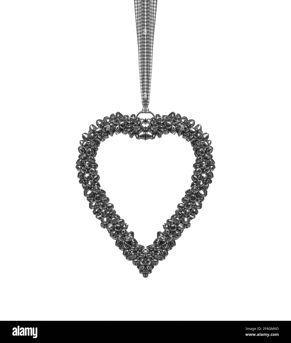 Figure sous la forme d'un coeur comme une suspension métallique isolée. Banque D'Images