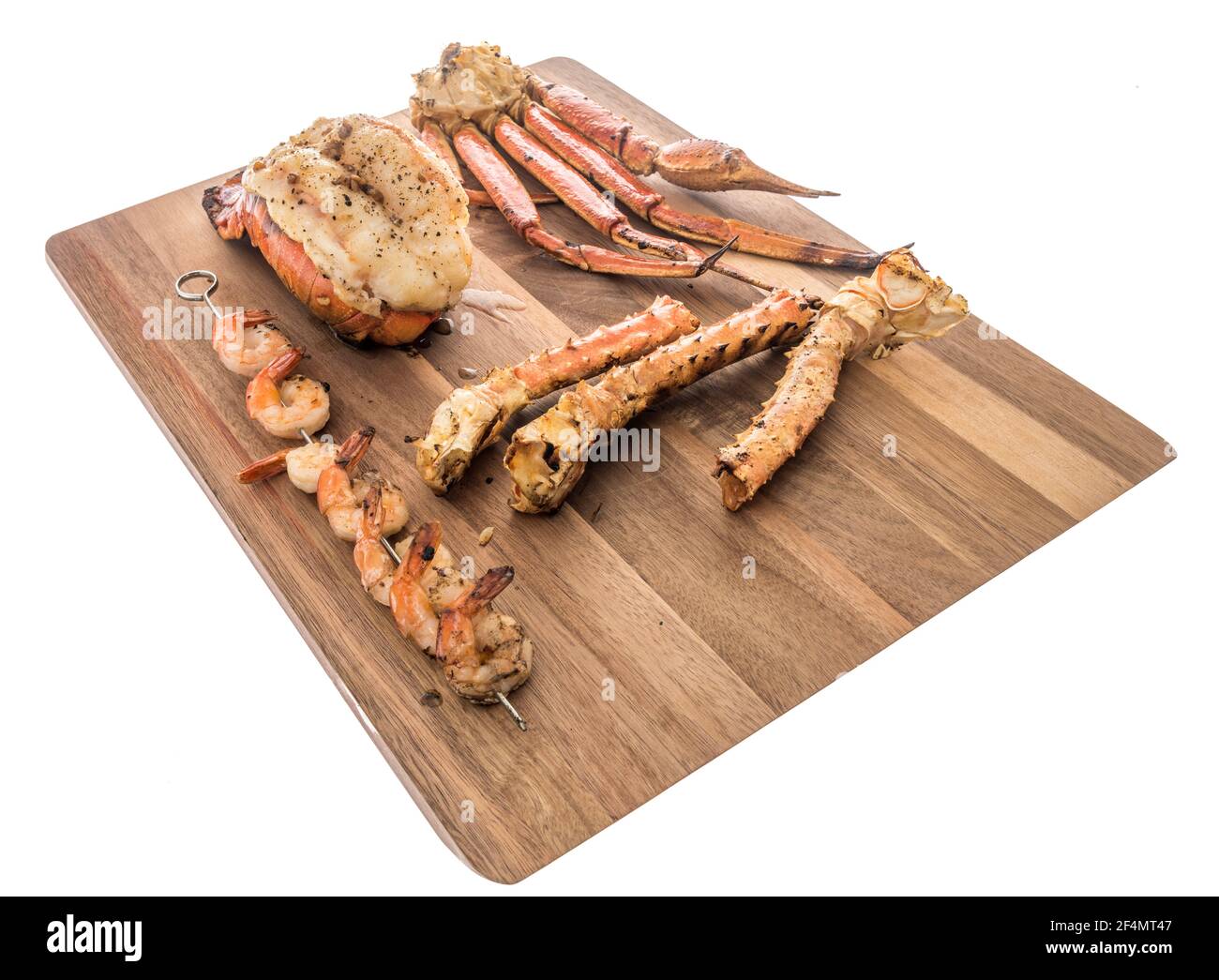 Une collection de différents types de fruits de mer avec queue de homard qui est le dos de selle, crevettes tigrées, crevettes sur brochettes, crabe des neiges de l'Alaska et roi d'Alaska c Banque D'Images