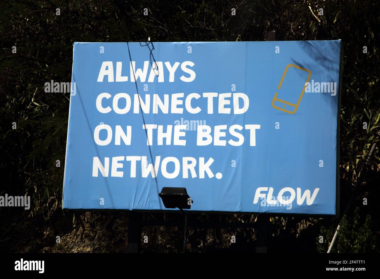 South St George's Grenada Mobile Network 'Flow' Publicité palissatrice Banque D'Images