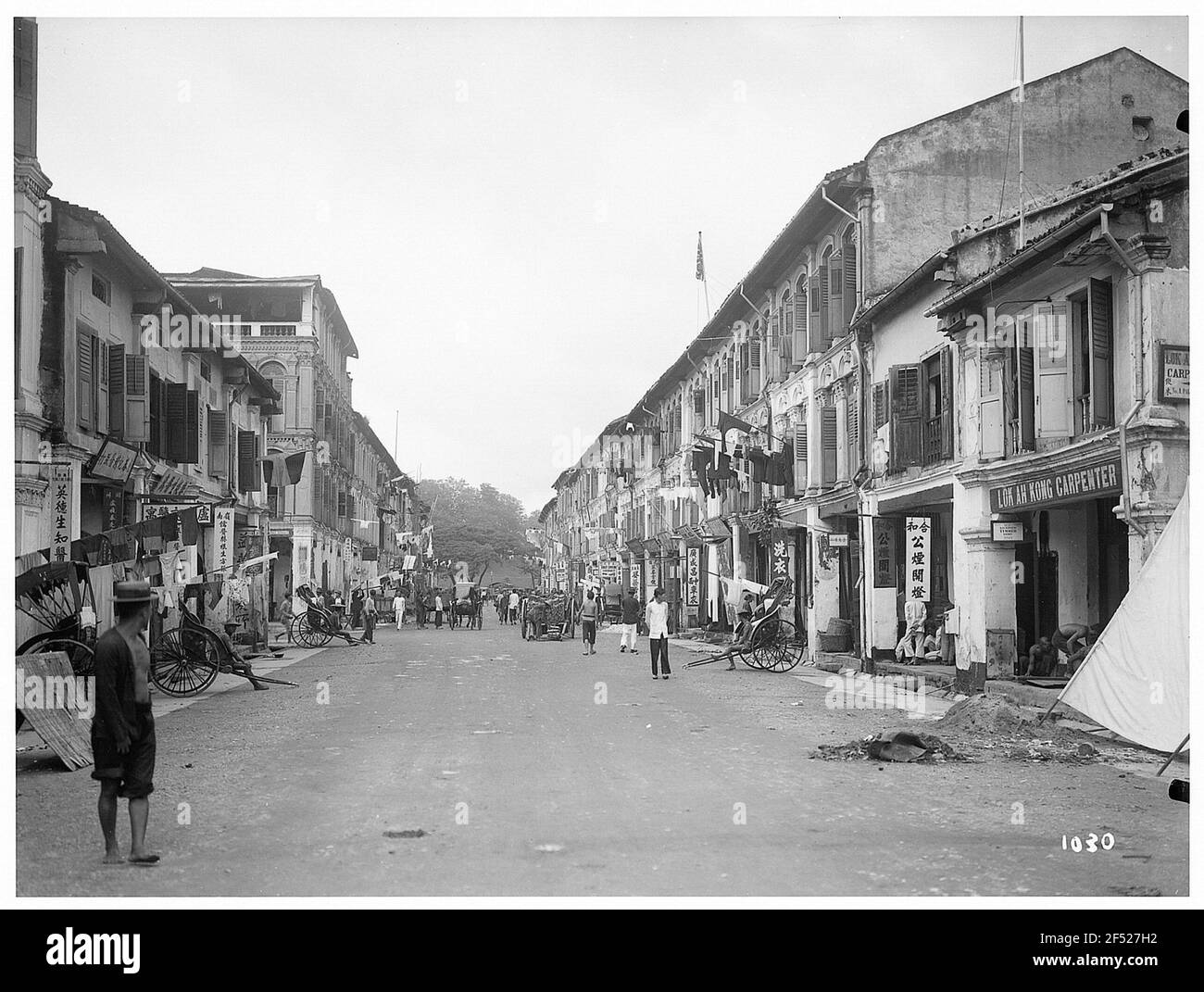 Rue commerçante de Singapour avec pousse-pousse Banque D'Images