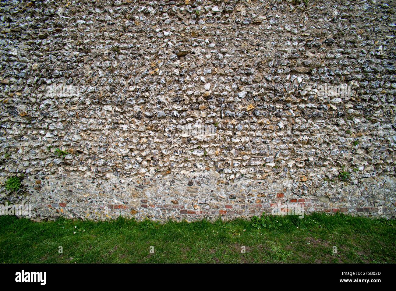 Mur en pierre de Flint. Mur du château. Arrière-plan. Banque D'Images