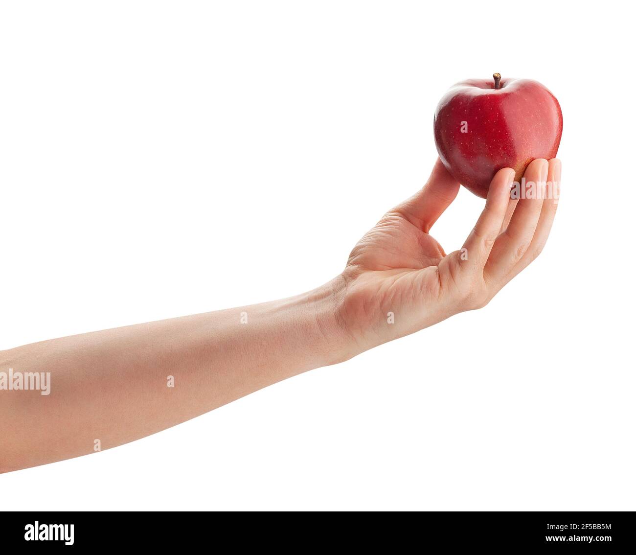 rouge délicieuse pomme dans le chemin de la main isolé sur blanc Banque D'Images