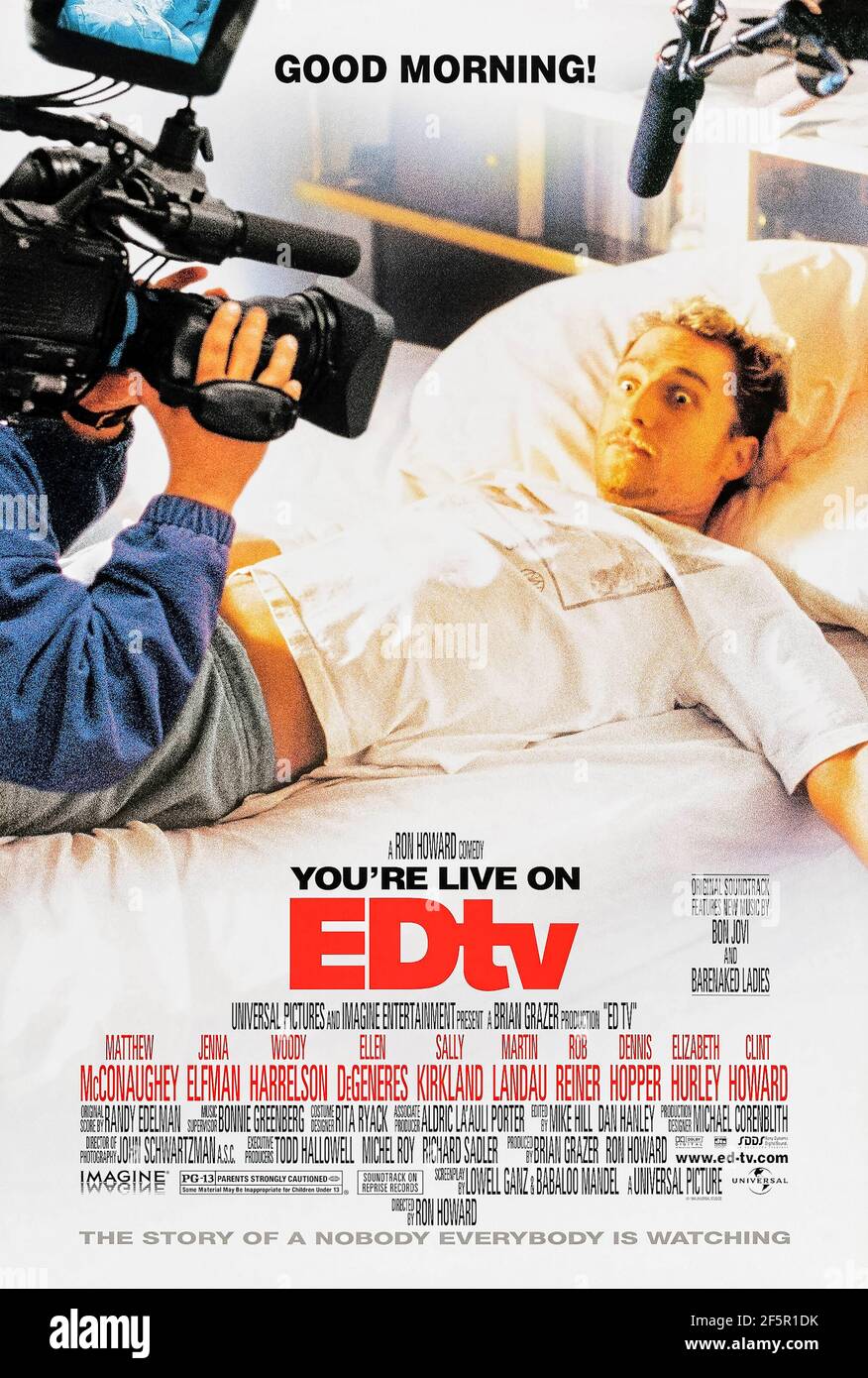 EDTV (1999) réalisé par Ron Howard et mettant en vedette Matthew McConaughey, Jenna Elfman et Geoffrey Blake. Un employé de la boutique vidéo accepte de faire filmer sa vie par une équipe de caméras pour une émission télévisée. Banque D'Images