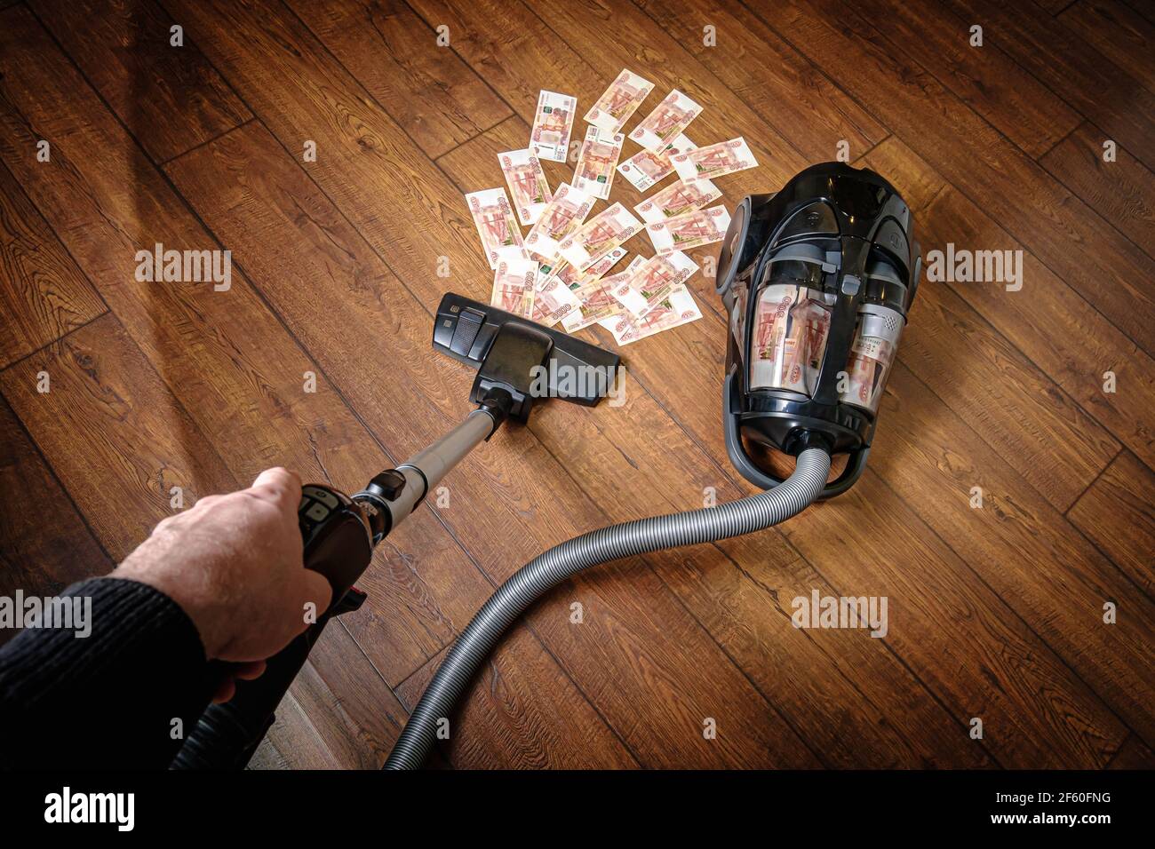 L'aspirateur à liquide récupère l'argent Banque D'Images