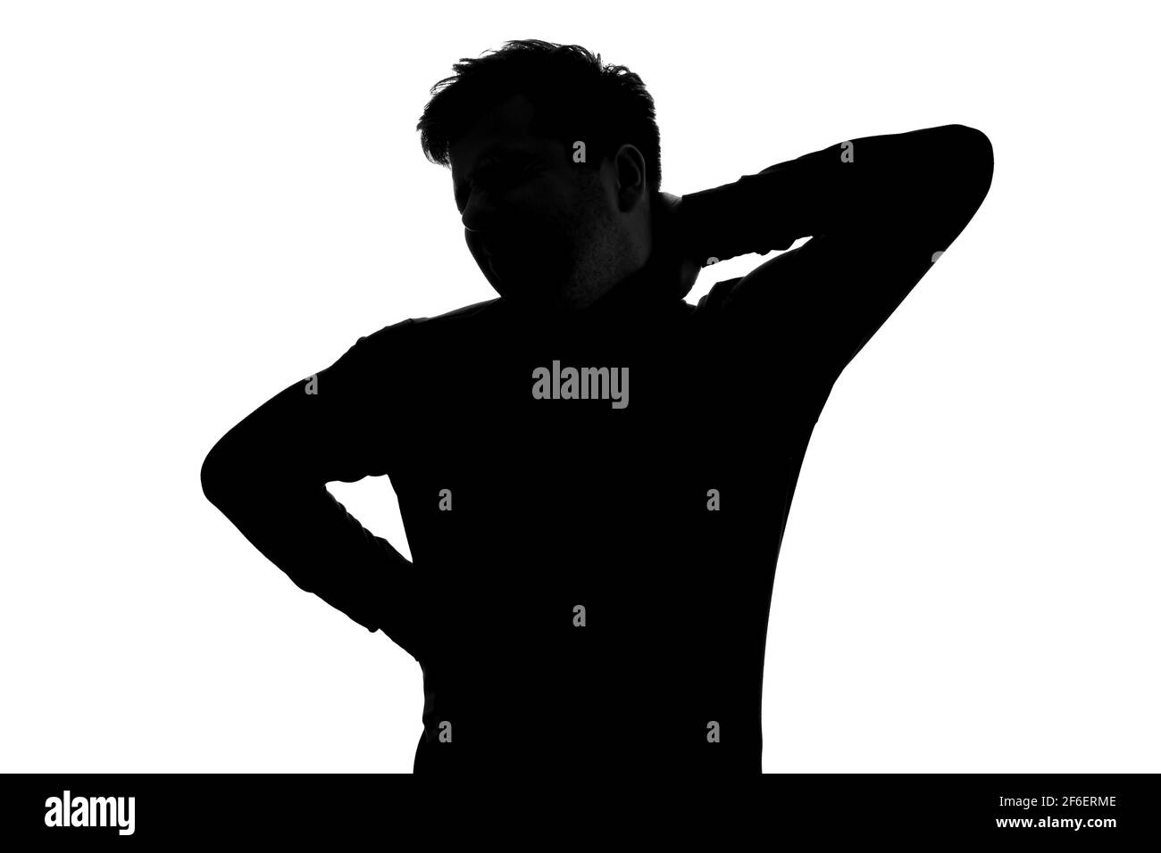 Silhouette de l'homme ayant des douleurs au cou souffrant de douleur. Prise de vue en studio Banque D'Images