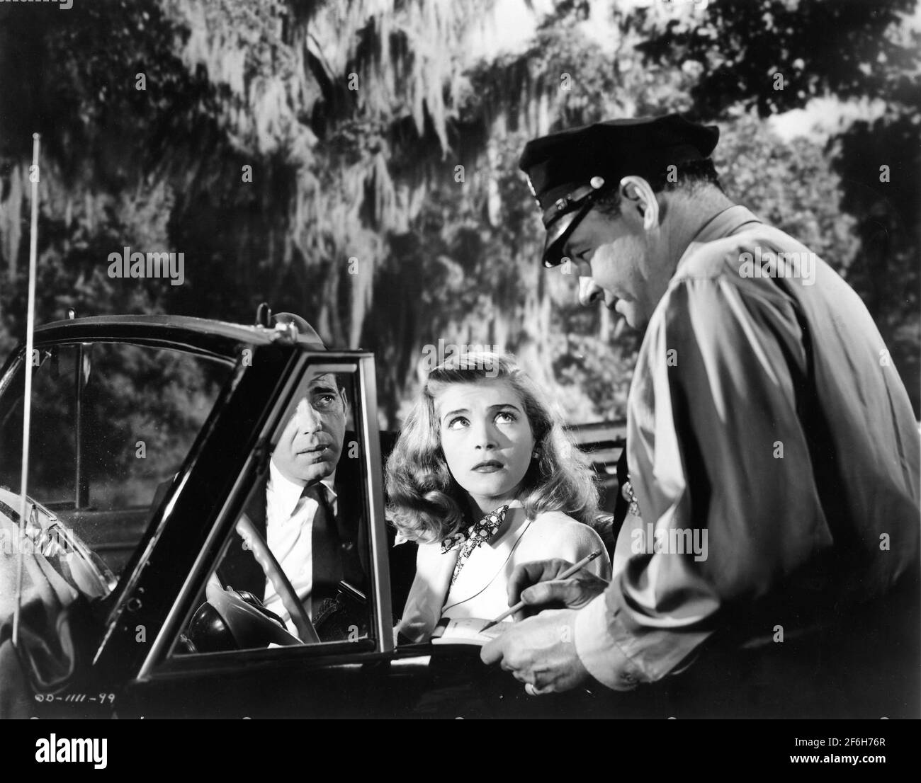 HUMPHREY BOGART LIZABETH SCOTT ET RAY TEAL À L'ESTIME 1947 réalisateur JOHN CROMWELL Columbia Pictures Banque D'Images