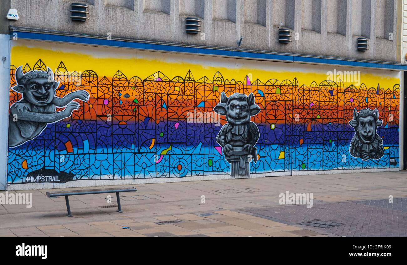 Légende de l'Imp Lincoln, cathédrale de Lincoln, emplacements dans le Lincolnshire, ancienne légende, diable a envoyé ses imp, vieux magasin, graffiti colorés. Banque D'Images