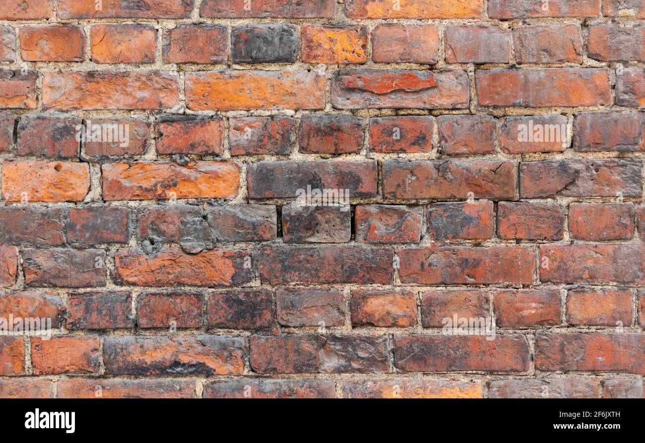 Photo d'arrière-plan sans couture d'un vieux mur de briques rouge grundy, texture gros plan Banque D'Images