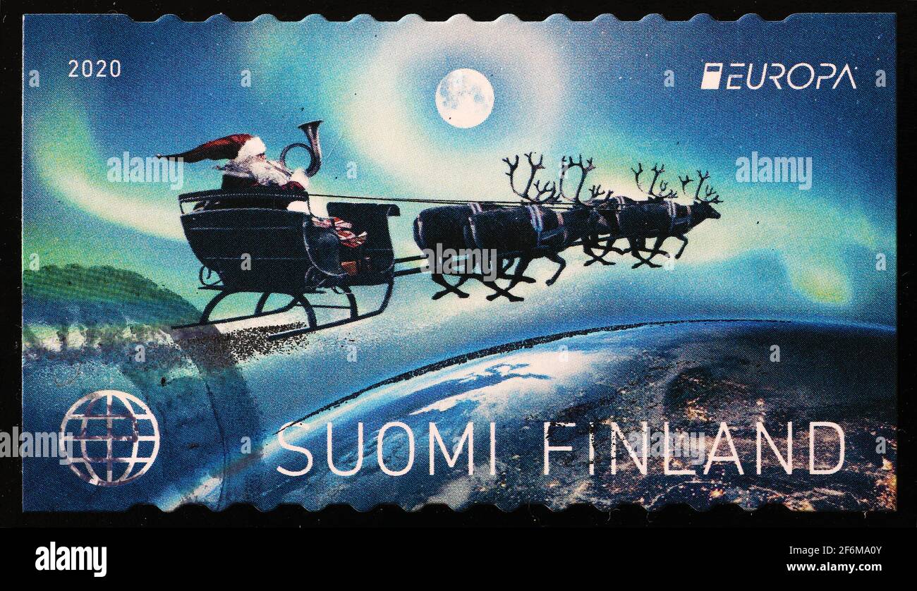 Le Père Noël vole sur son traîneau en timbre finlandais Banque D'Images