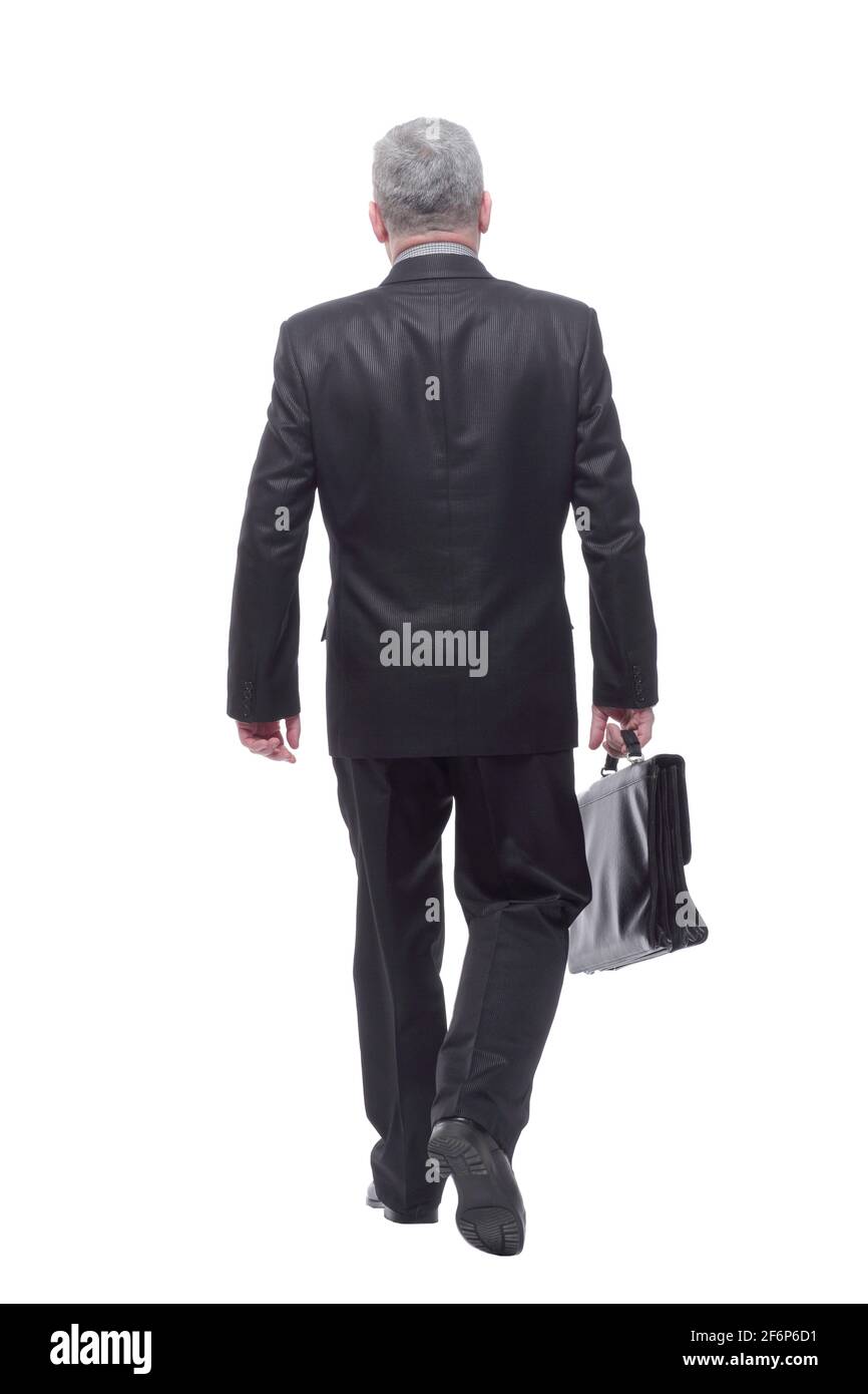 Vue arrière de l'homme d'affaires marchant avec sa mallette Banque D'Images