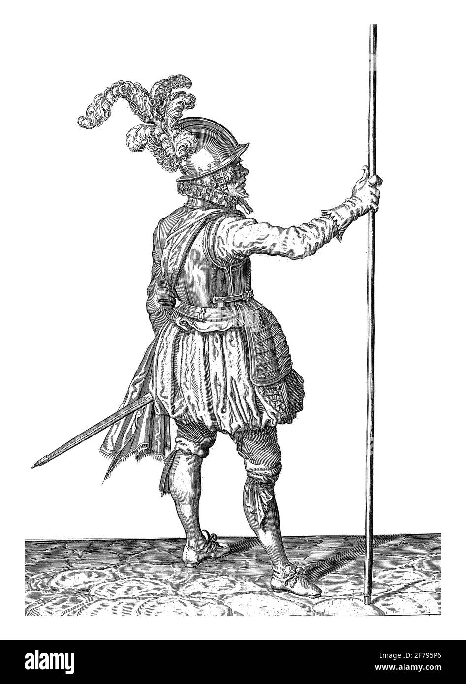 Un soldat, pleine longueur, vu de l'arrière, tenant une brochette (lance) debout avec sa main droite, gravure vintage. Banque D'Images