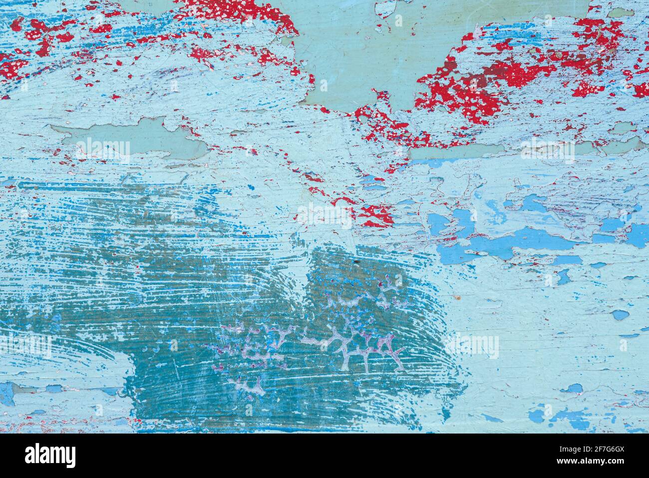 Arrière-plan abstrait peint avec des motifs aléatoires de couches de vieux et de la peinture abîmé sur une surface en bois Banque D'Images