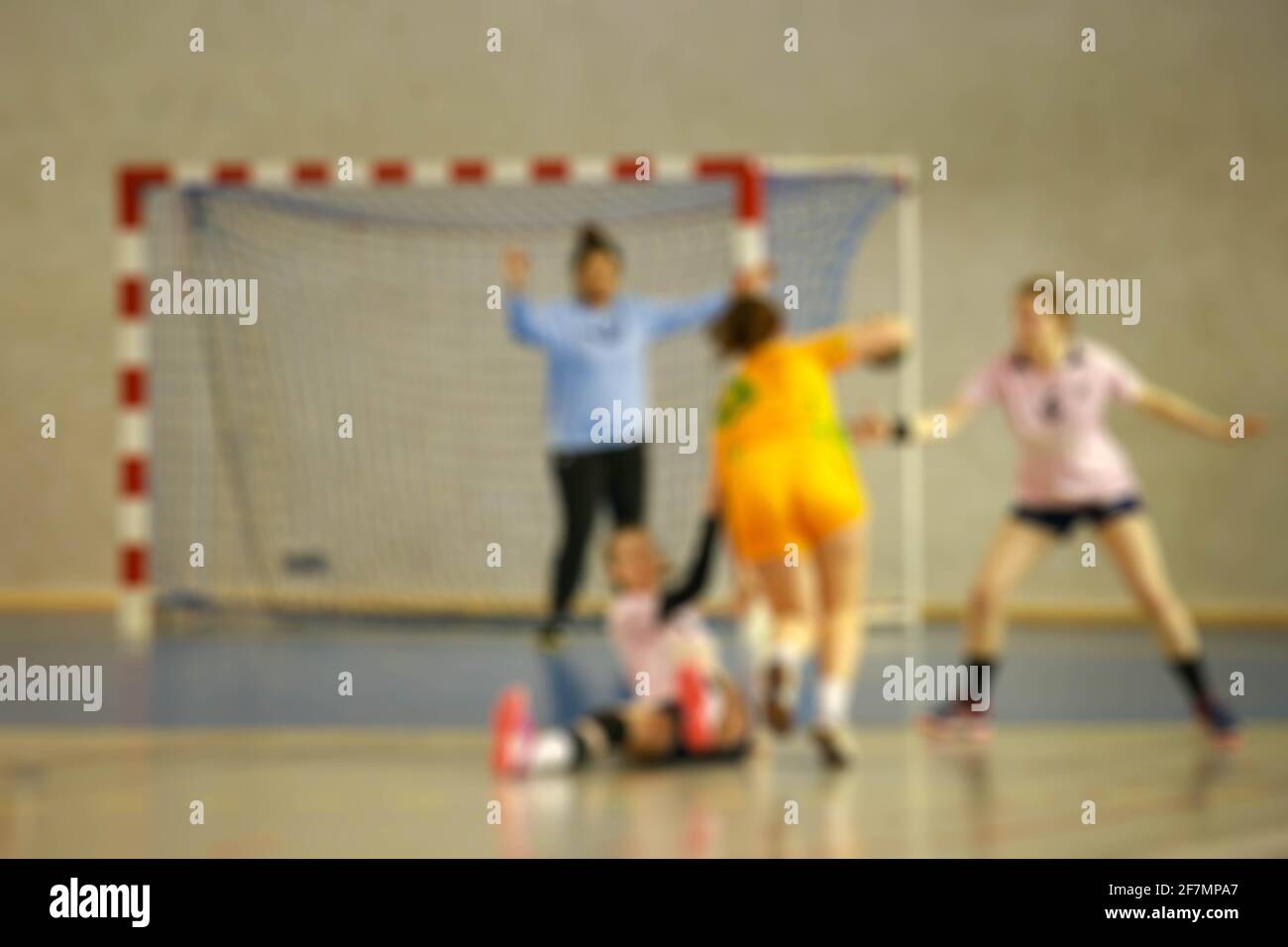 Image floue des joueuses de handball en action Banque D'Images