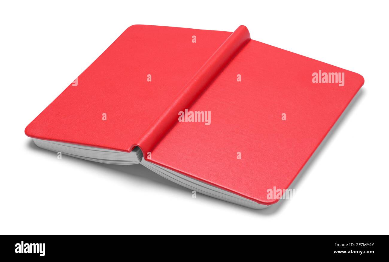 Livre d'esquisse rouge ouvert face vers le bas découpe. Banque D'Images