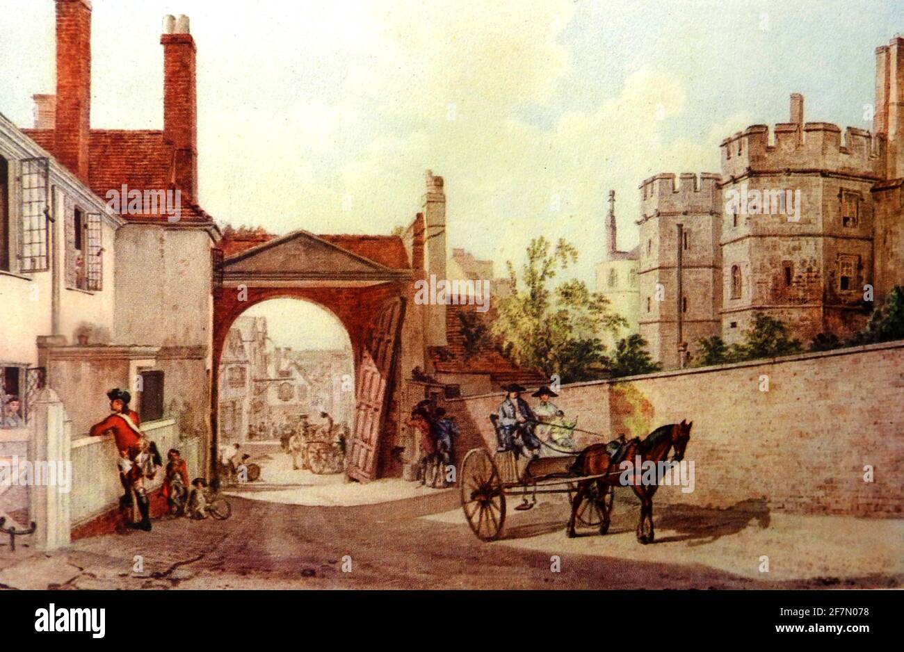 L'approche de l'entrée principale du château de Windsor, Windsor, Angleterre comme elle était au milieu du XVIIIe siècle montrant un cheval et une voiturette sur Castle Hill près de la porte d'accès de Henry VIII. Un garde hors service est vu parler par-dessus le mur à une femme au foyer. La ville de Windsor est en arrière-plan. Le château original a été construit après l'invasion normande de l'Angleterre par Guillaume le Conquérant et a continué d'être occupé par le monarque régnant depuis. C'est le palais le plus occupé d'Europe Banque D'Images