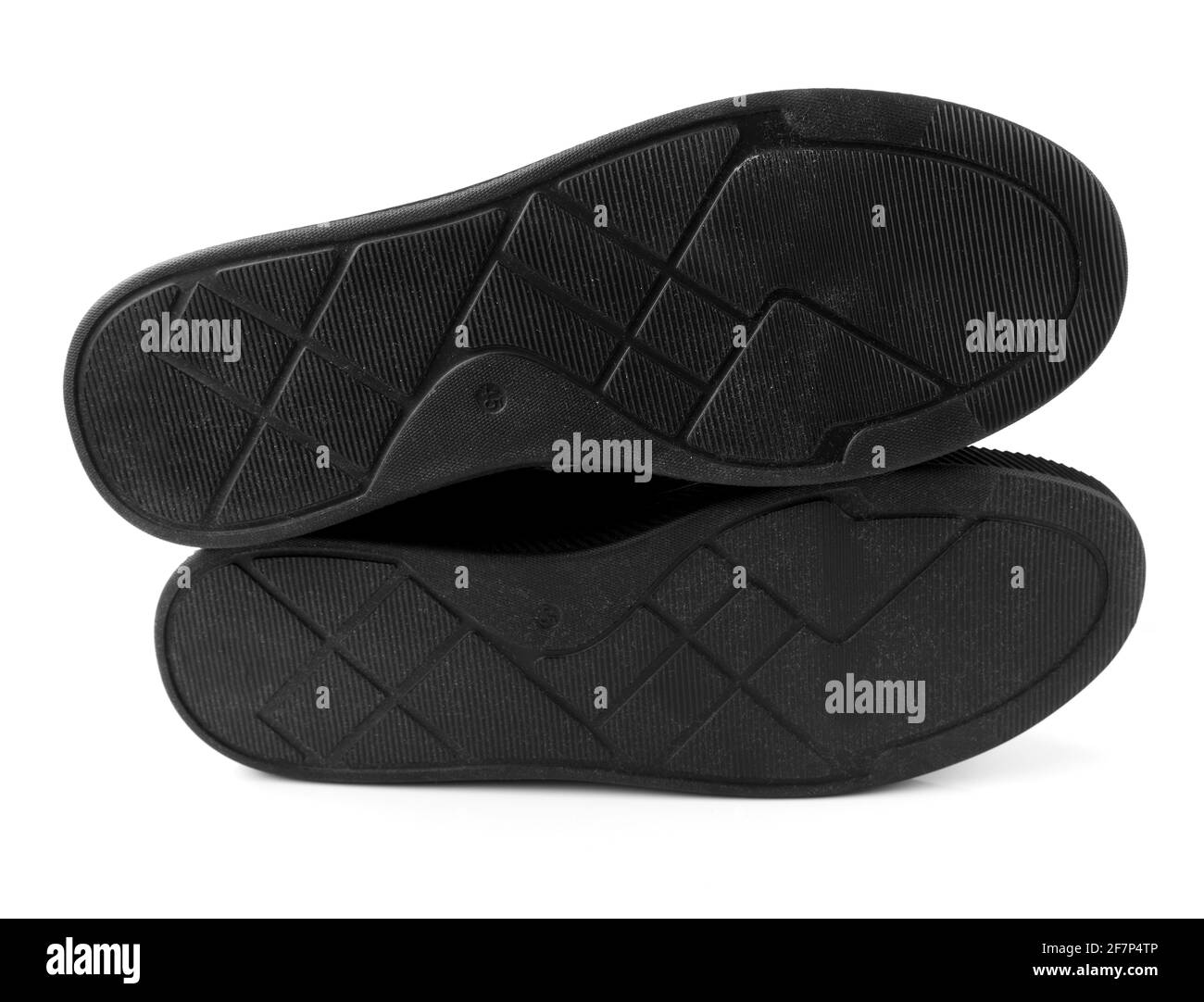 Semelle en caoutchouc noir pour chaussures pour hommes sur fond blanc Banque D'Images