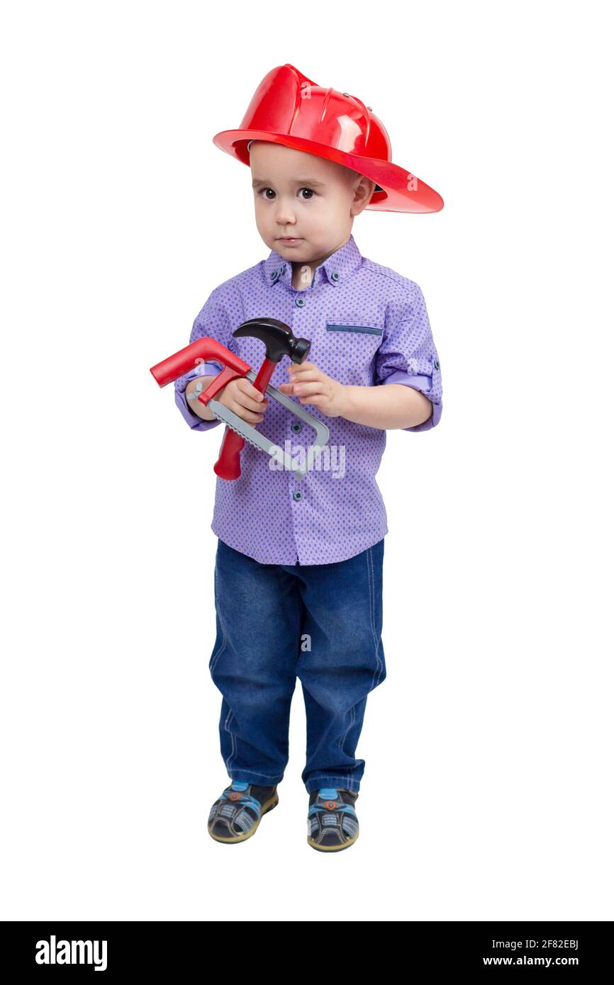 Enfant de 2-3 ans avec les mains d'outils de construction de jouets. Banque D'Images