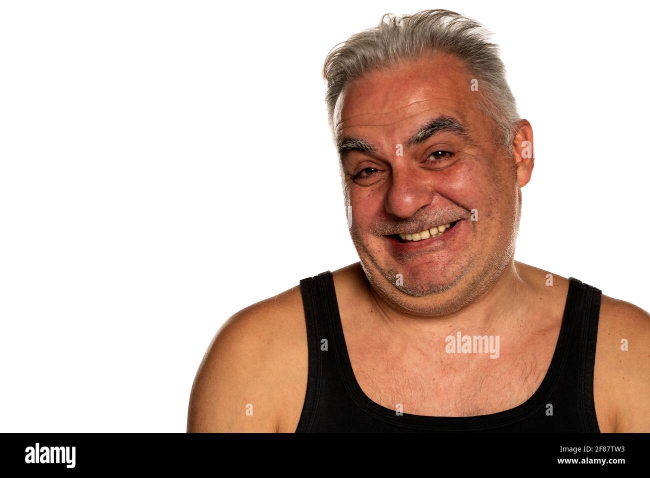 Joyeux et drôle, non rasé, homme d'âge moyen avec un petit gris cheveux Banque D'Images