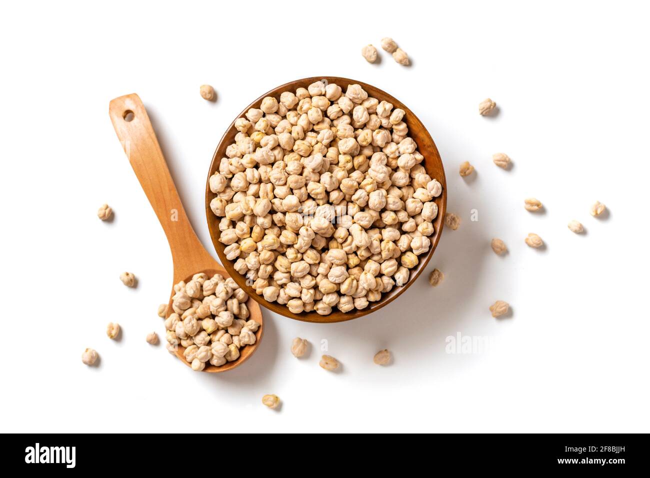 Pois chiches secs dans un bol en bois isolé sur fond blanc alimentation saine, protéines végétales concept vue du dessus Flat Lay. Banque D'Images