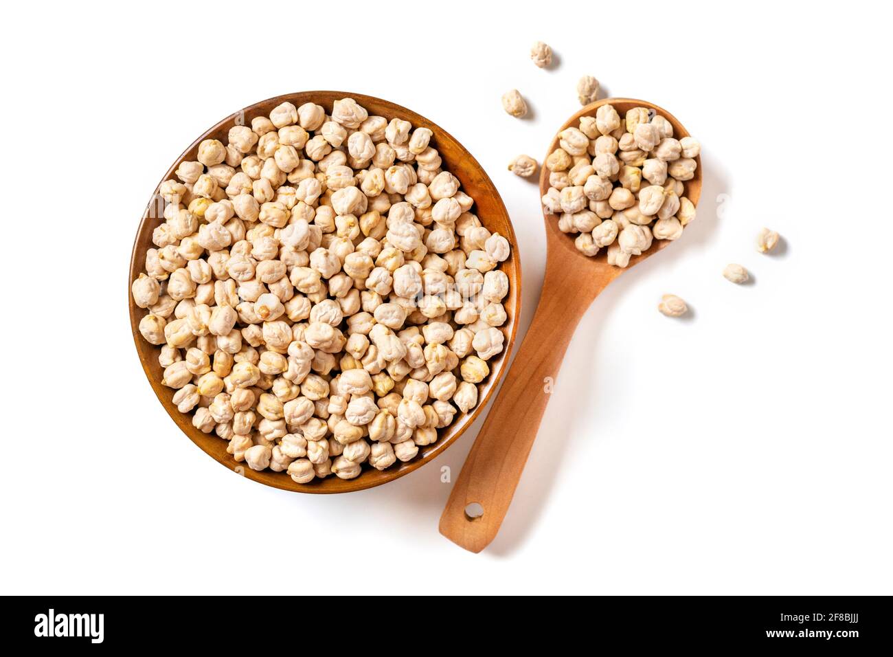 Pois chiches secs dans un bol en bois isolé sur fond blanc alimentation saine, protéines végétales concept vue du dessus Flat Lay. Banque D'Images