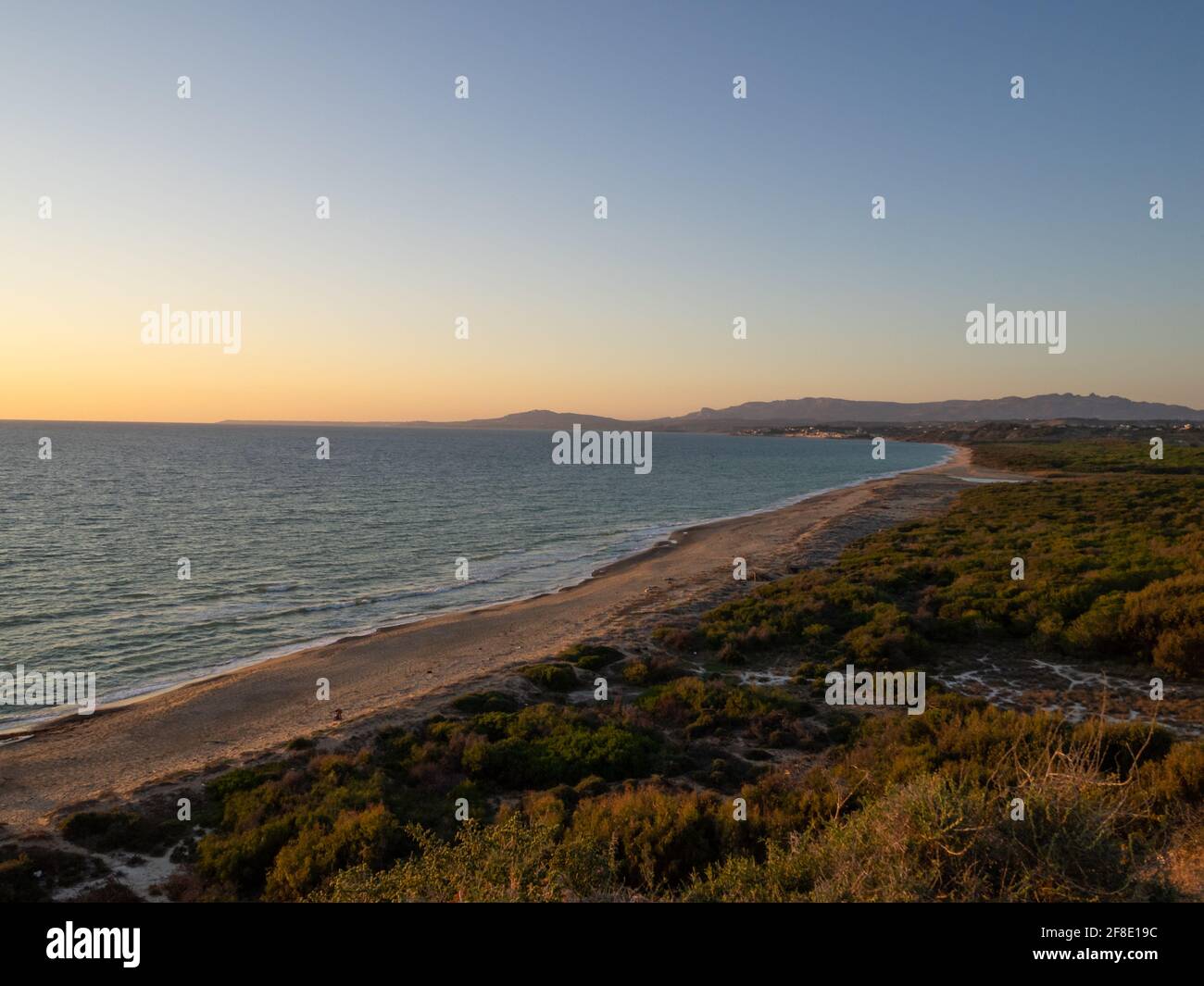Plage de Capo Bianco au coucher du soleil Banque D'Images