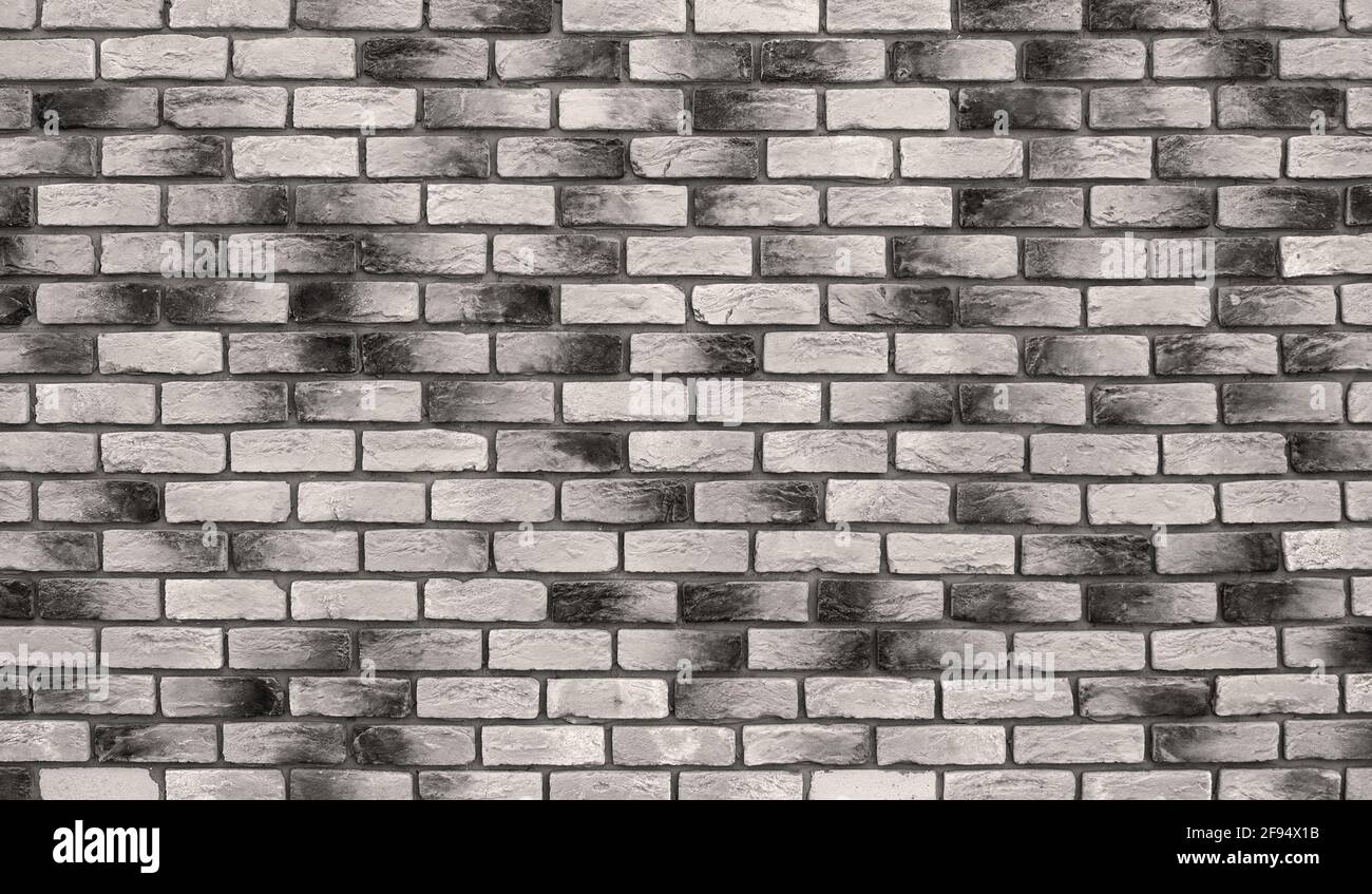 Simple fait main mur de briques noir et blanc. Photo détaillée du brickwork. Banque D'Images