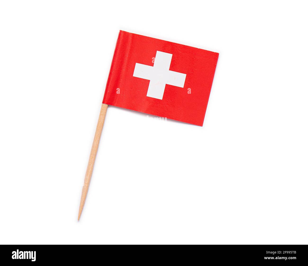 Drapeau en papier de la Suisse sur un cure-dent en bois isolé sur blanc Banque D'Images