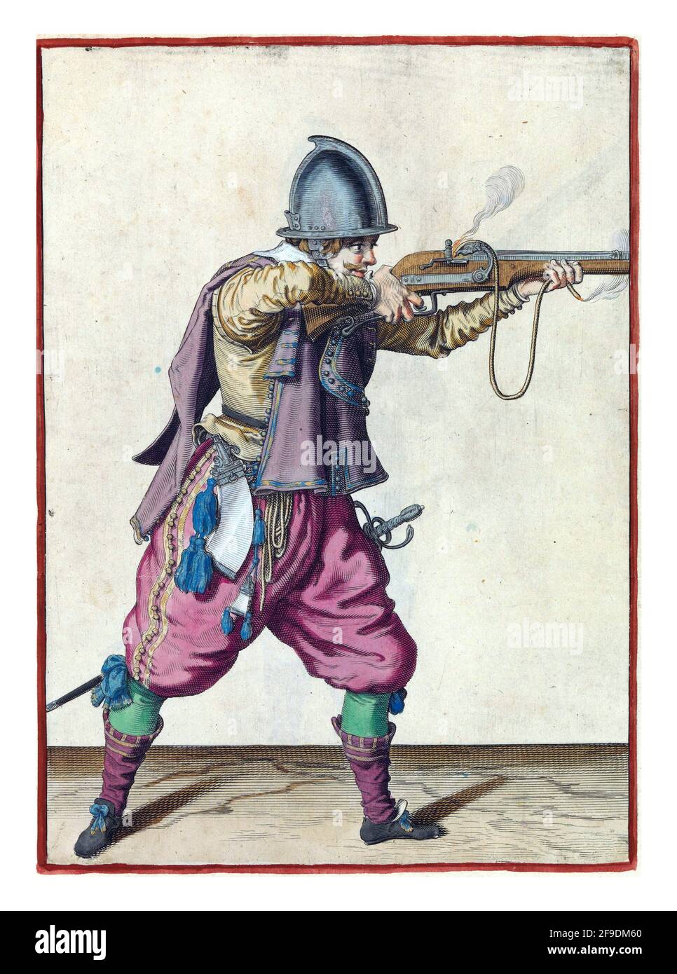 Un soldat, de pleine longueur, à droite, tenant une barre (un type d'arme à feu) horizontale avec les deux mains, en visant et en tirant Banque D'Images