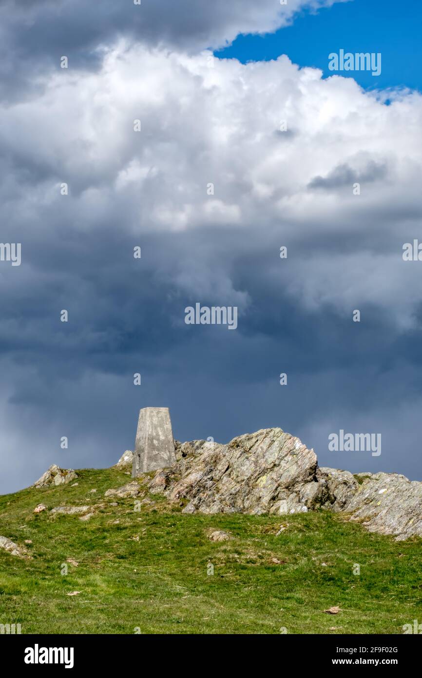 Trig point & Storm Clouds Banque D'Images