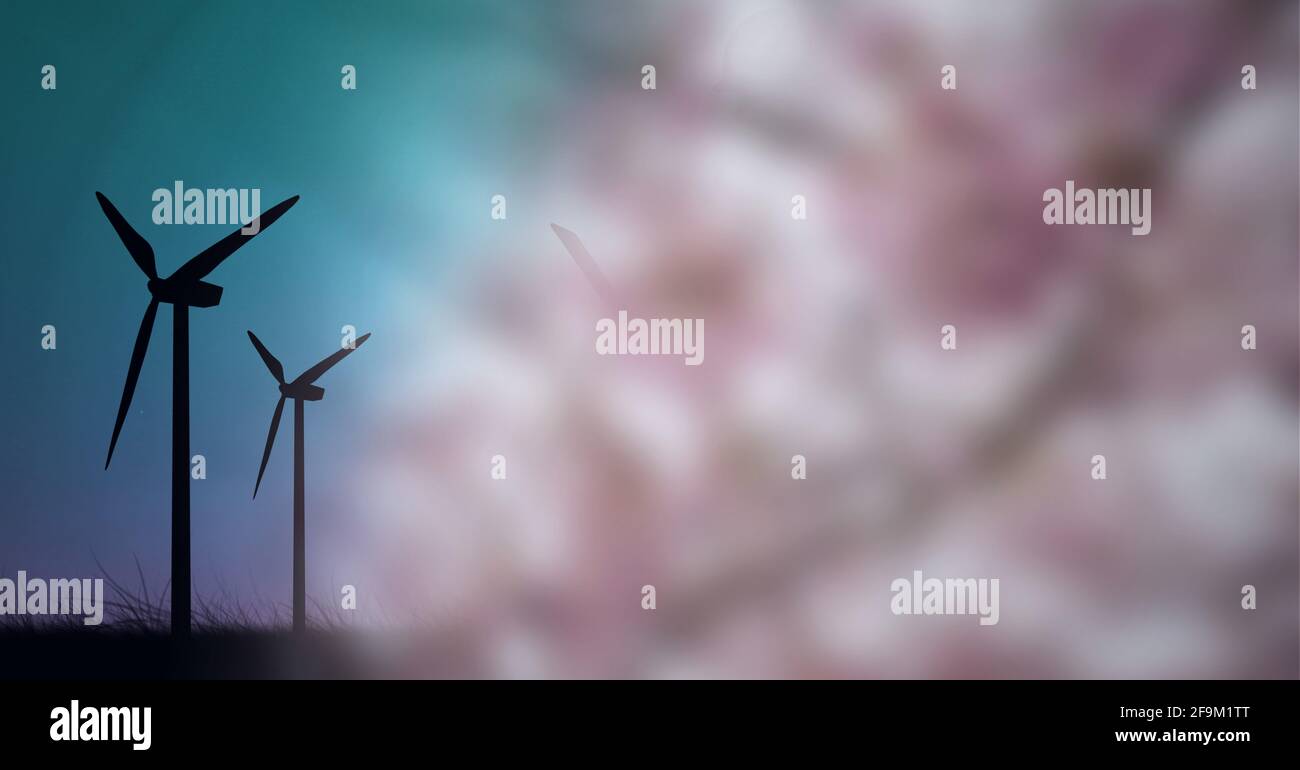 Composition des éoliennes en campagne avec arbre en fleur Banque D'Images