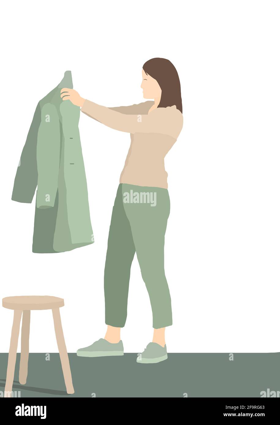 Femme d'âge moyen choisissant son manteau à la maison avec un arrière-plan isolé. Concept de mode durable 2021. Banque D'Images