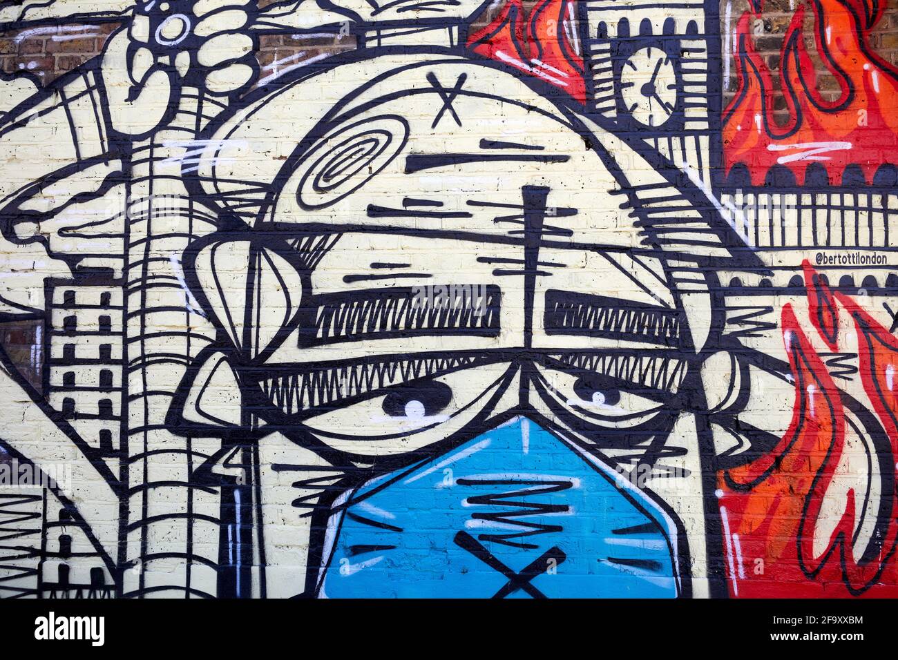 Londres, Royaume-Uni - 18 avril 2021 : une fresque de rue, dessinée pendant la pandémie du coronavirus par l'artiste de graffiti Panik, sur le mur latéral d'un magasin de cram de glace . Banque D'Images