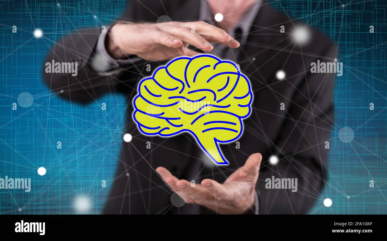 Concept d'esprit humain entre les mains d'un homme en arrière-plan Photo  Stock - Alamy