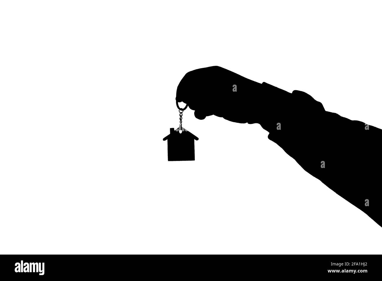 Silhouette d'un agent immobilier tenant un jouet de maison entre les mains sur fond blanc Banque D'Images