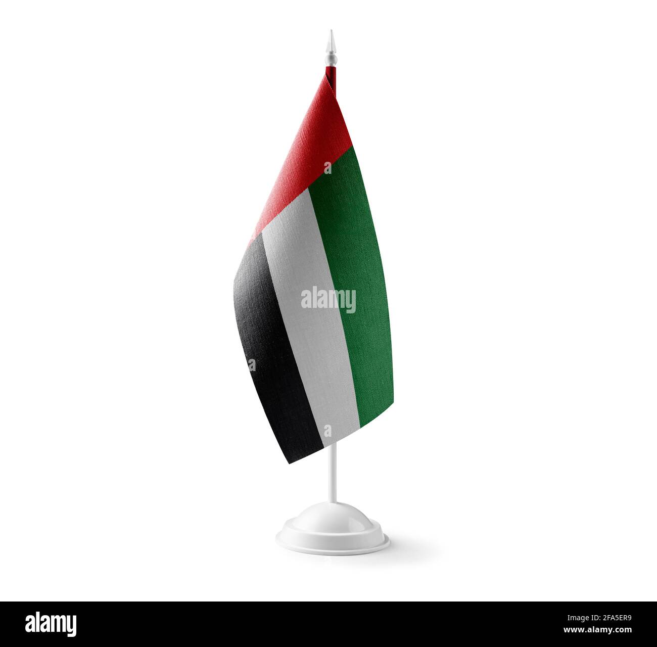 Petit drapeau national des Émirats arabes Unis sur un arrière-plan blanc Banque D'Images