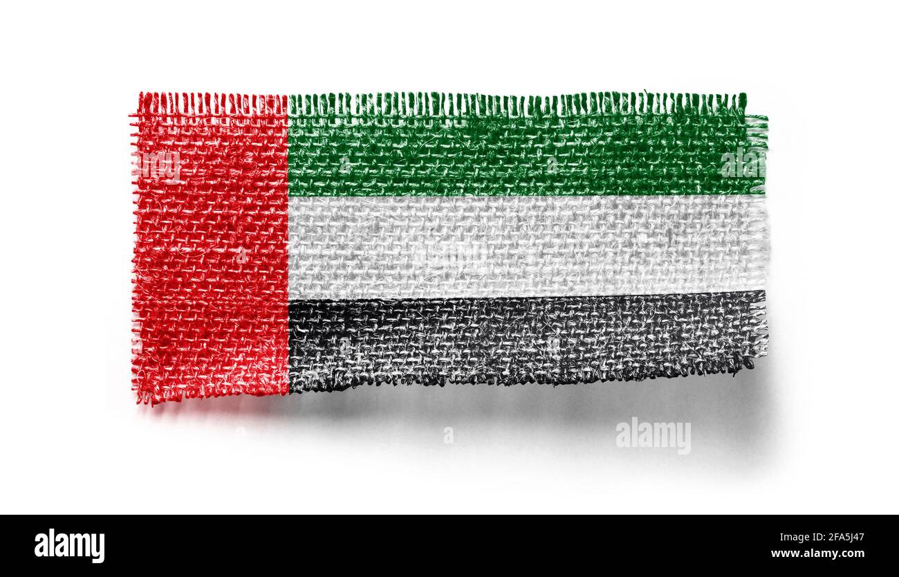 Drapeau des Émirats arabes Unis sur un morceau de tissu un arrière-plan blanc Banque D'Images