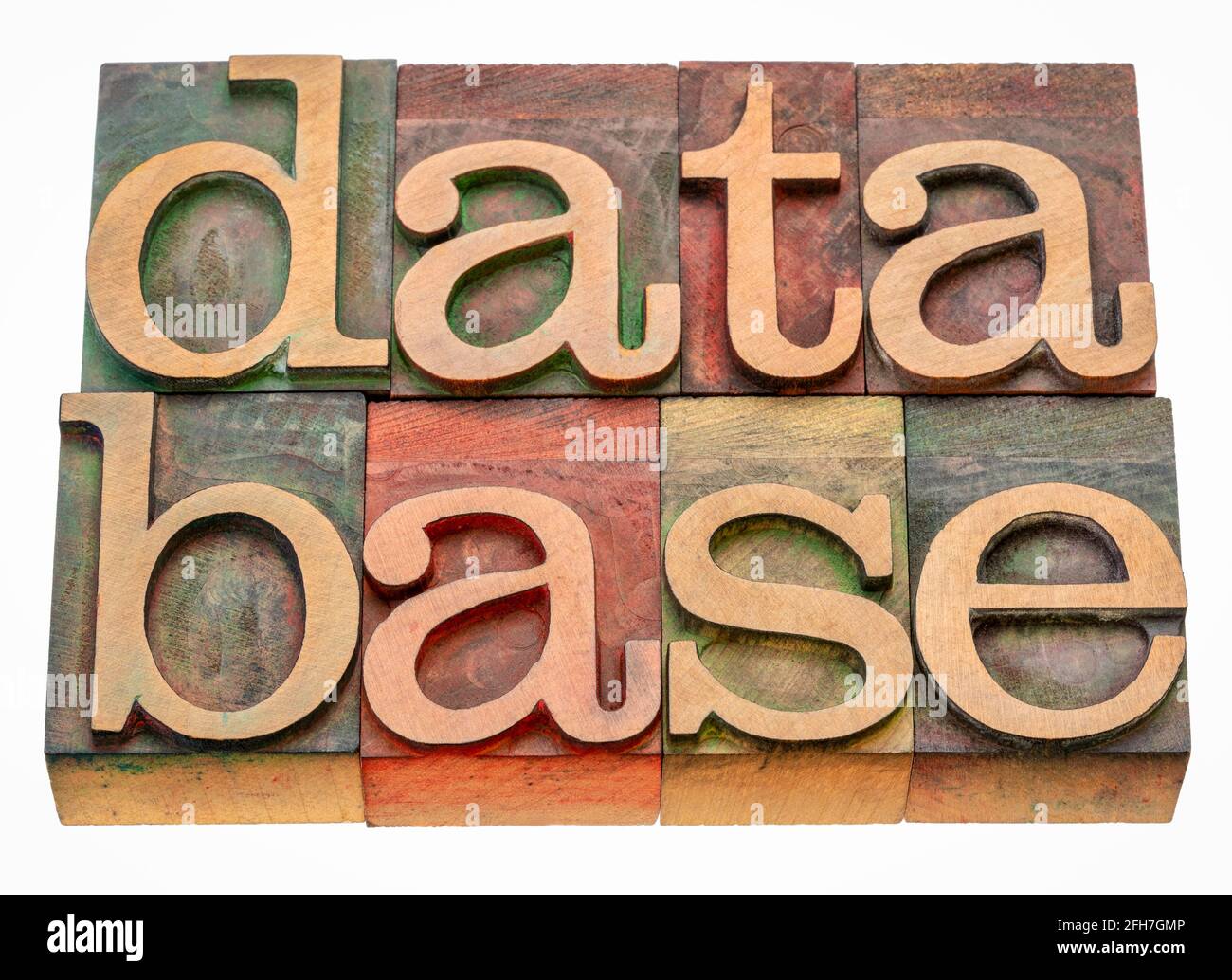 base de données extrait de mot isolé dans le type de bois de typographie vintage teinté par des encres de couleur, concept de technologie de l'information Banque D'Images