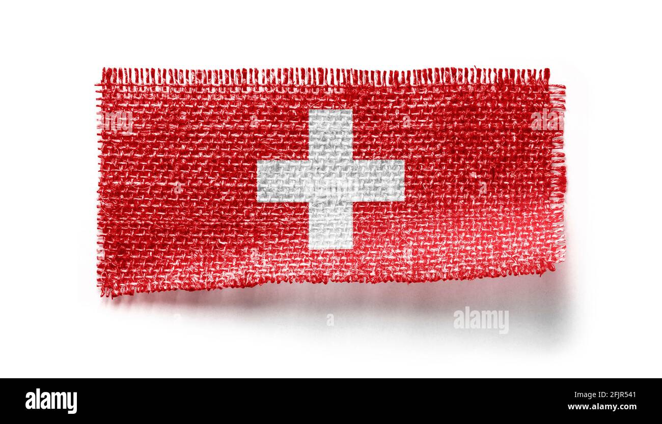 Drapeau suisse sur un morceau de tissu sur un blanc arrière-plan Banque D'Images