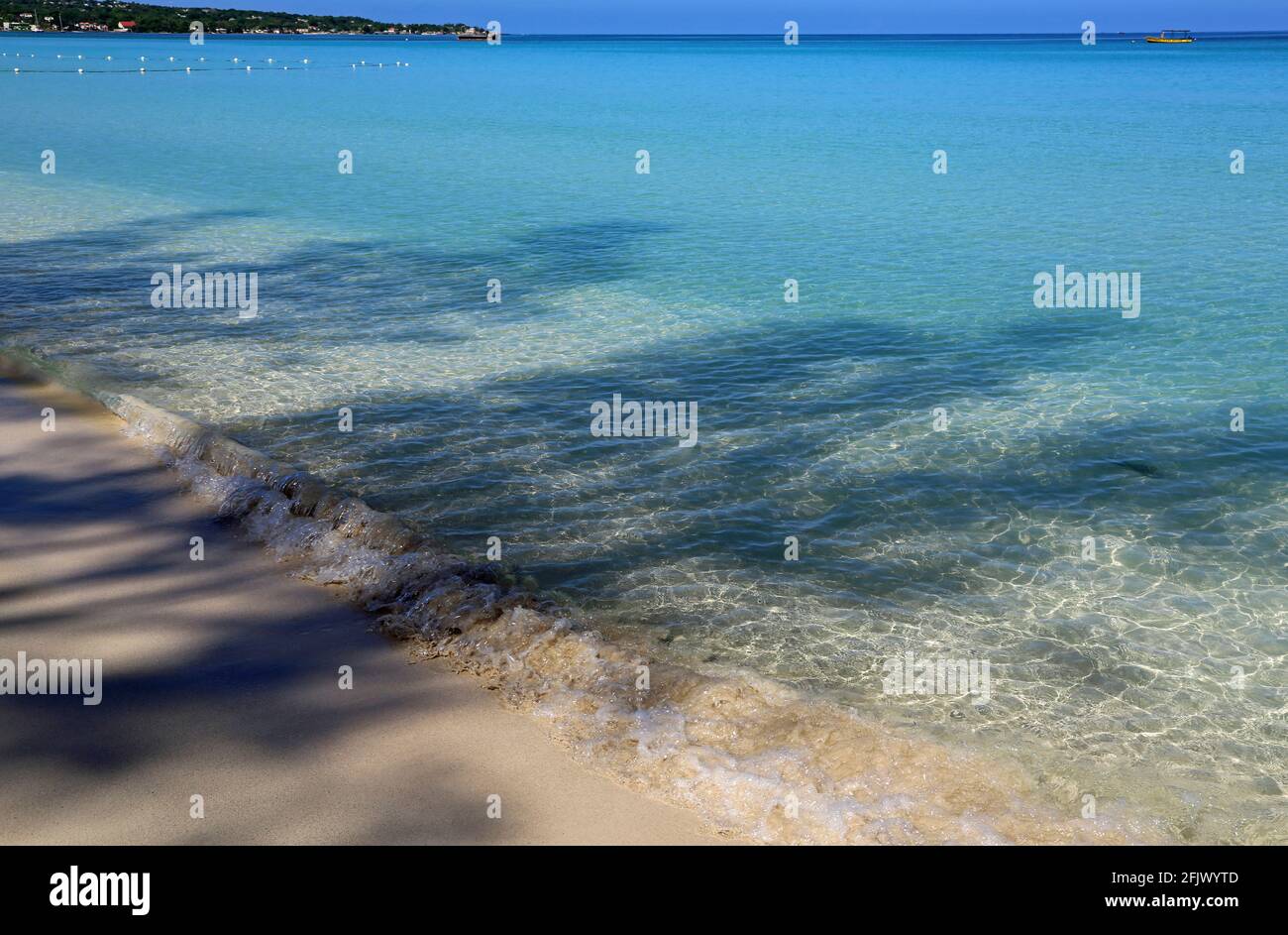 Ombres sur la plage de 7 miles, Jamaïque Banque D'Images